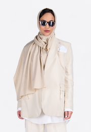 Close-up front view of model wearing EMIRATES LIMITED Beige Long Scarf, East Vibe
